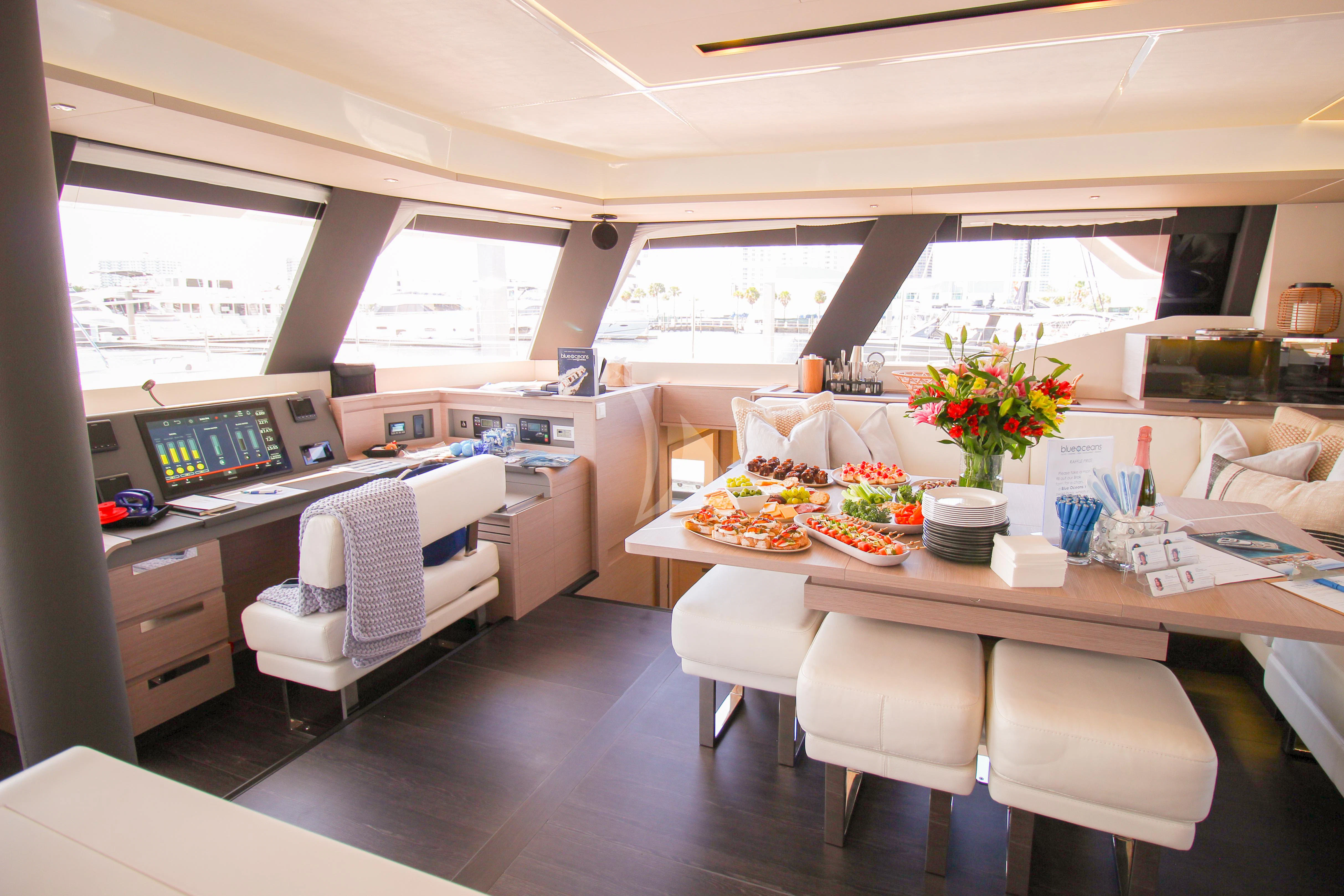 a room with a table and chairs aboard PRINCESS MILA Yacht for Charter