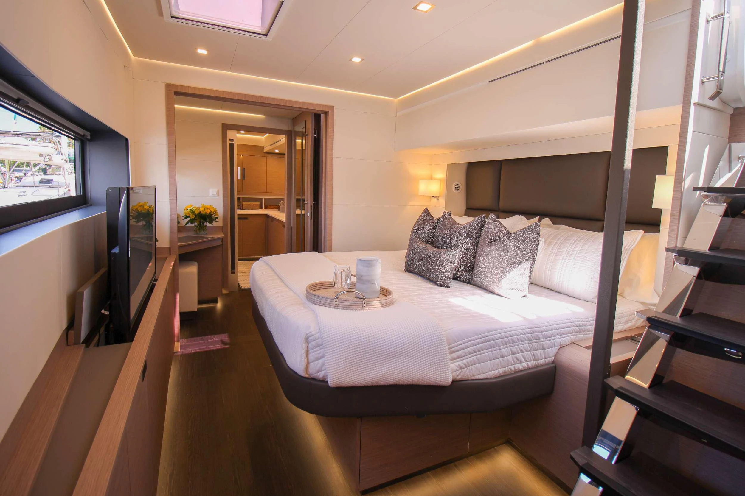 a hotel room with a bed and a coffee table aboard PRINCESS MILA Yacht for Charter