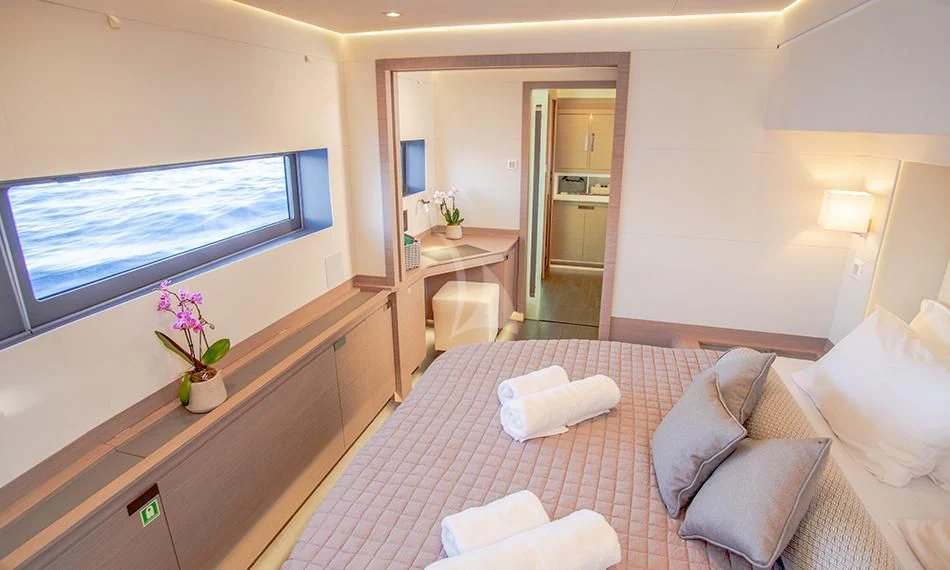 a hotel room with a bed and a tv aboard PRINCESS MILA Yacht for Charter