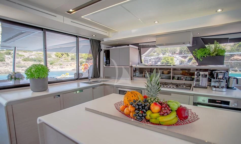 a kitchen with a large window aboard PRINCESS MILA Yacht for Charter