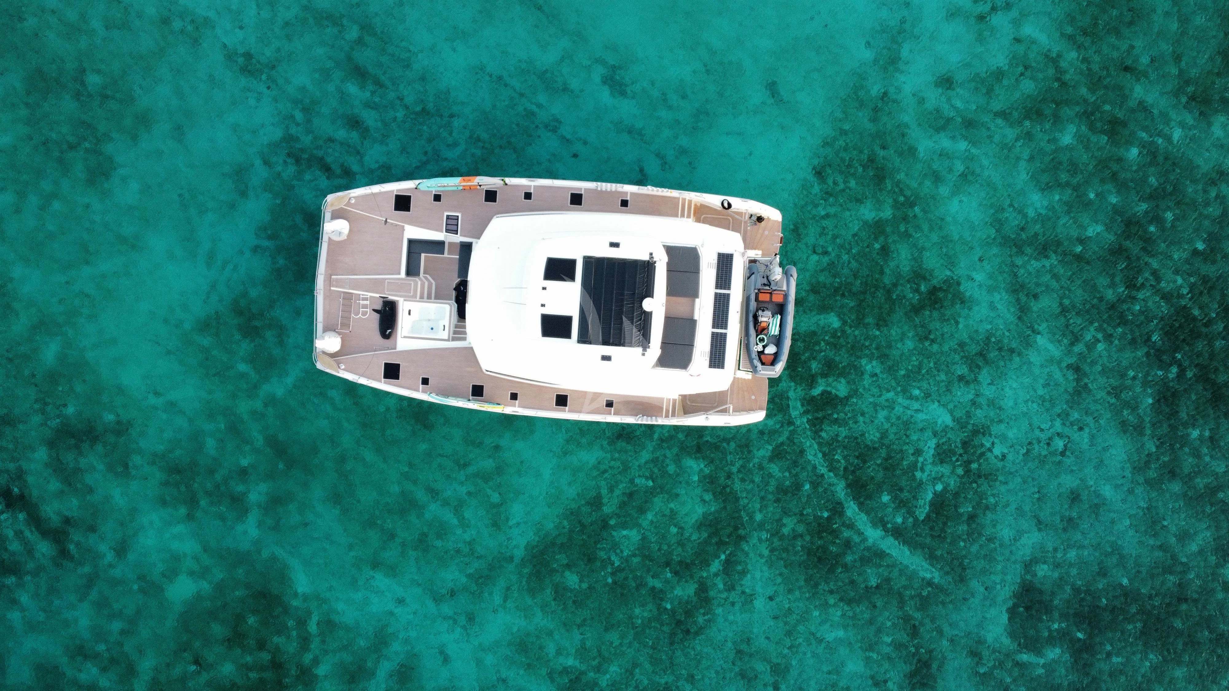 a helicopter flying over water aboard PRINCESS MILA Yacht for Charter