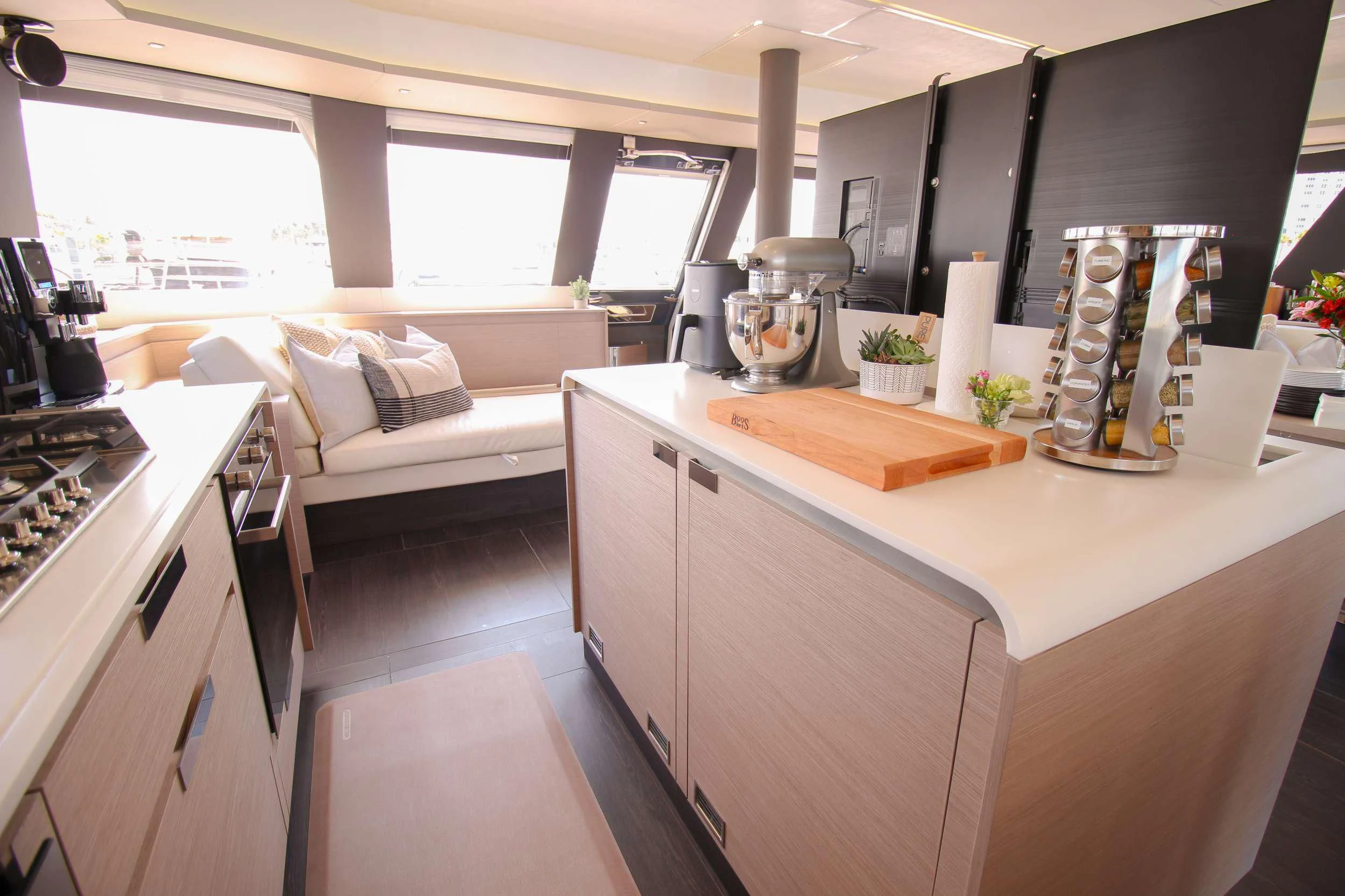 a kitchen with a couch and a table aboard PRINCESS MILA Yacht for Charter