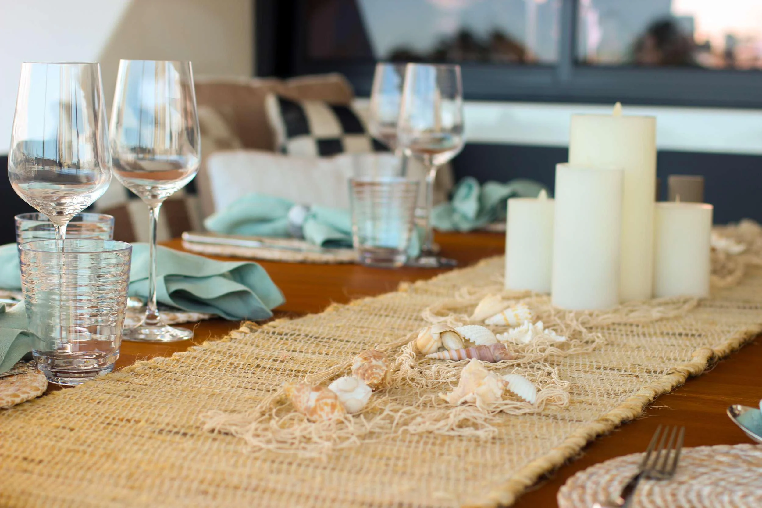 a table with candles and plates aboard PRINCESS MILA Yacht for Charter