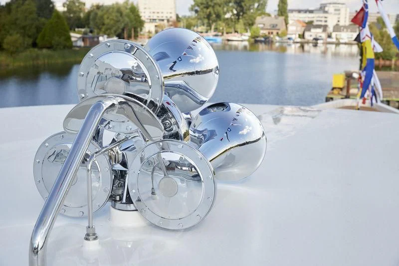 a white motorcycle on a snowy road aboard SAMAYA Yacht for Sale