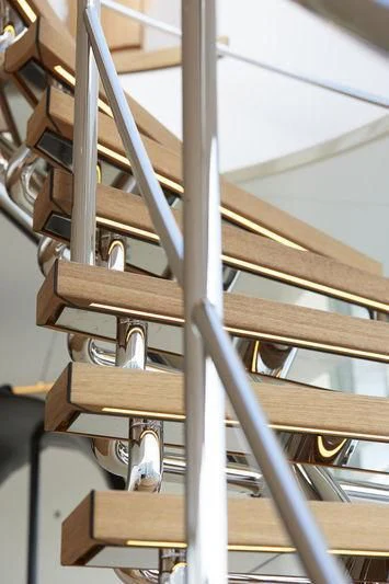 a close-up of a wooden staircase aboard SAMAYA Yacht for Sale
