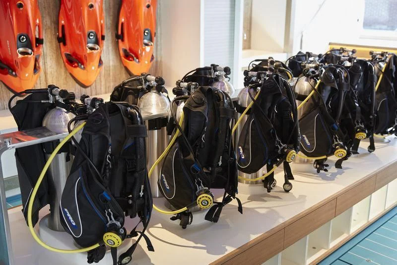 a group of black and silver robot toys on a table aboard SAMAYA Yacht for Sale