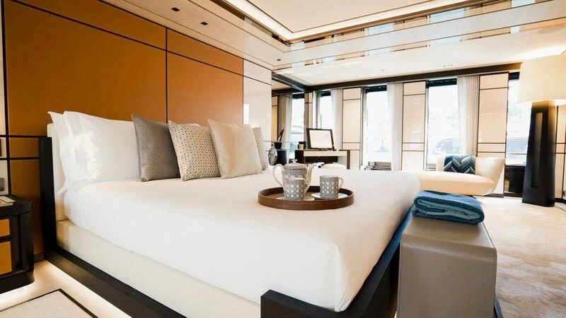 a large bed with a white bed aboard RELIANCE Yacht for Sale