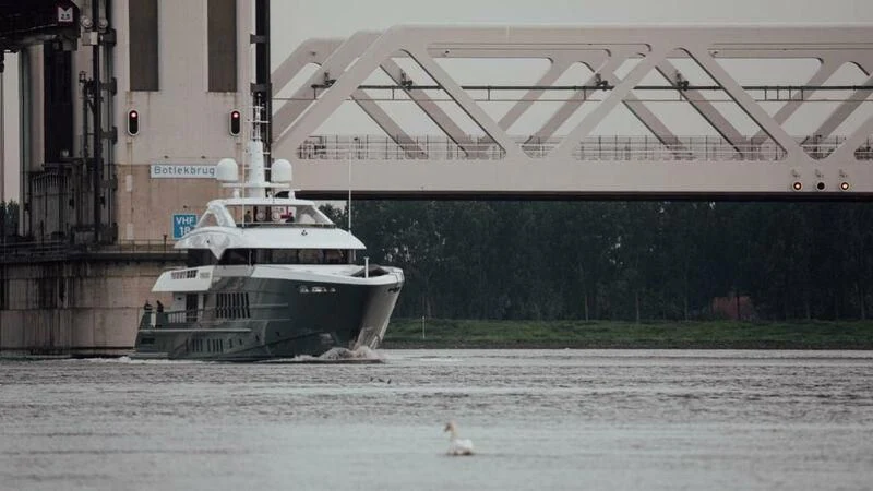 a large white boat sits in a body of water aboard RELIANCE Yacht for Sale