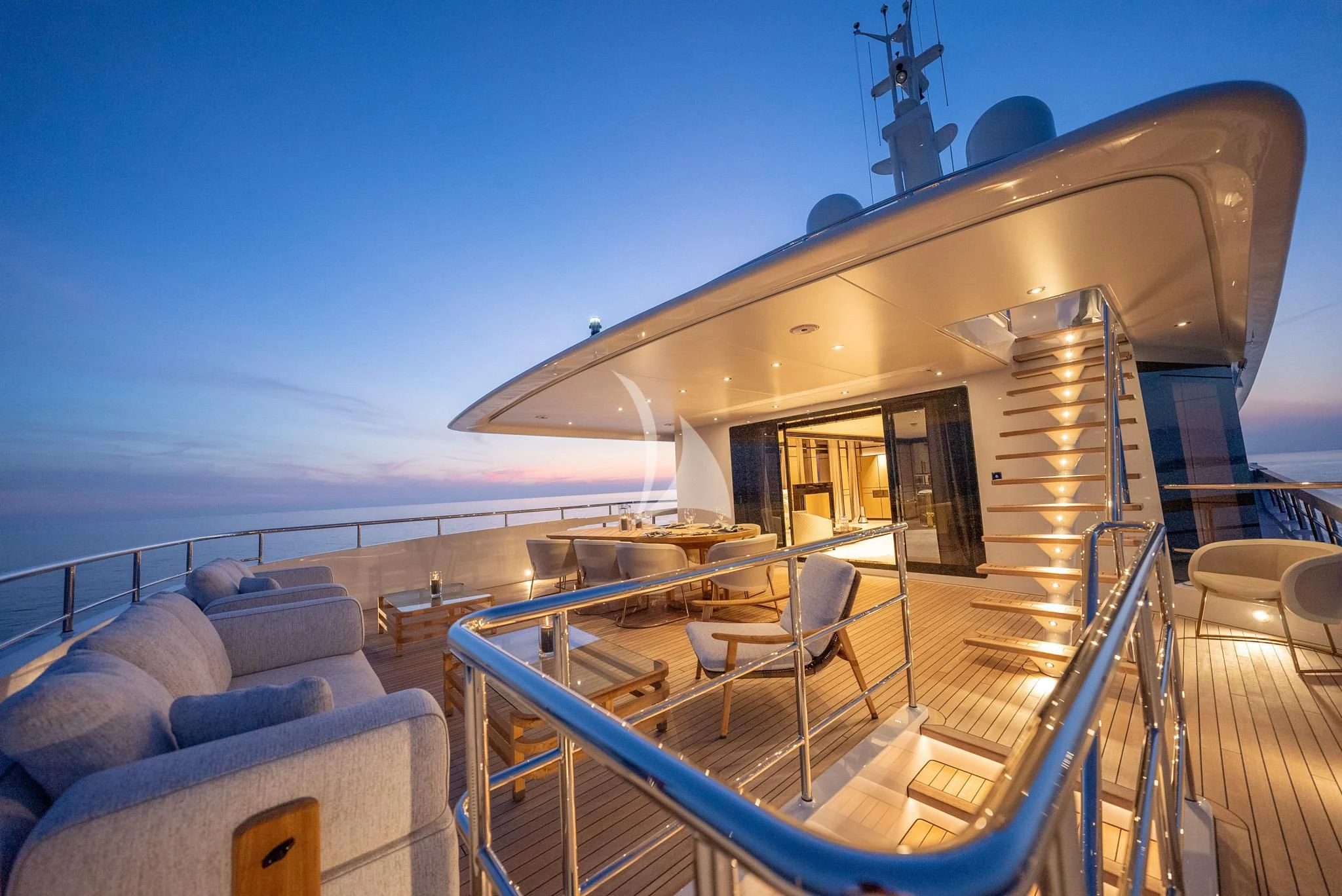 a deck with a large deck and a large boat on it aboard RELIANCE Yacht for Sale