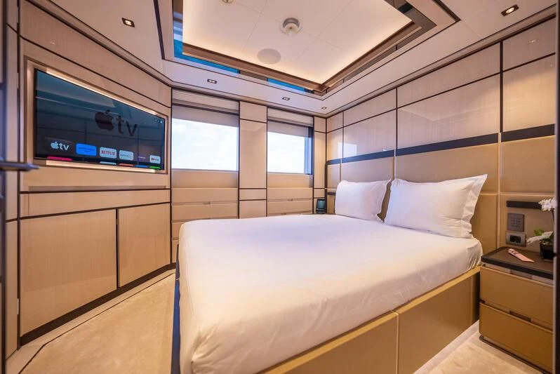 a room with a bed and a tv aboard RELIANCE Yacht for Sale