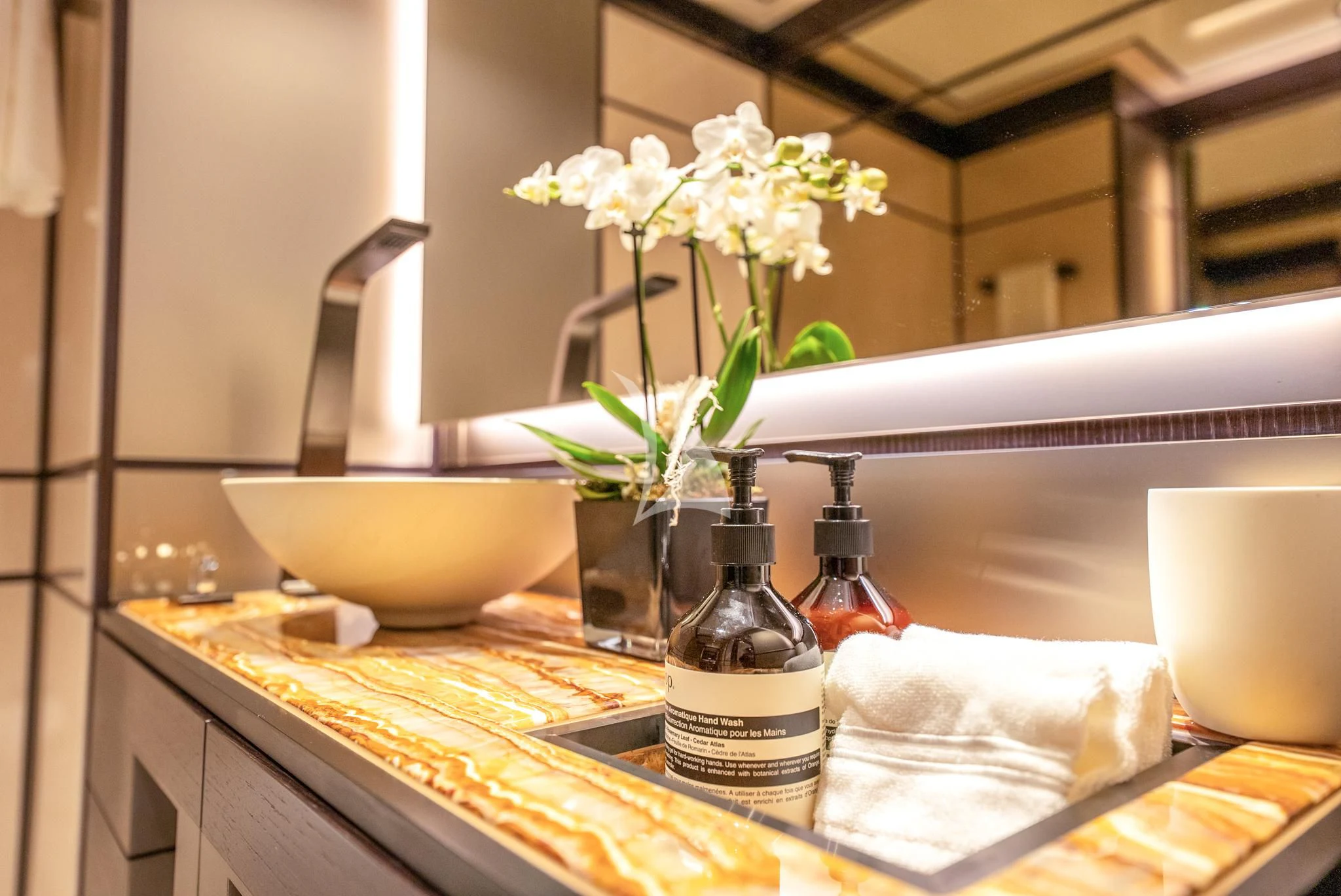 a bottle of wine on a counter aboard RELIANCE Yacht for Sale