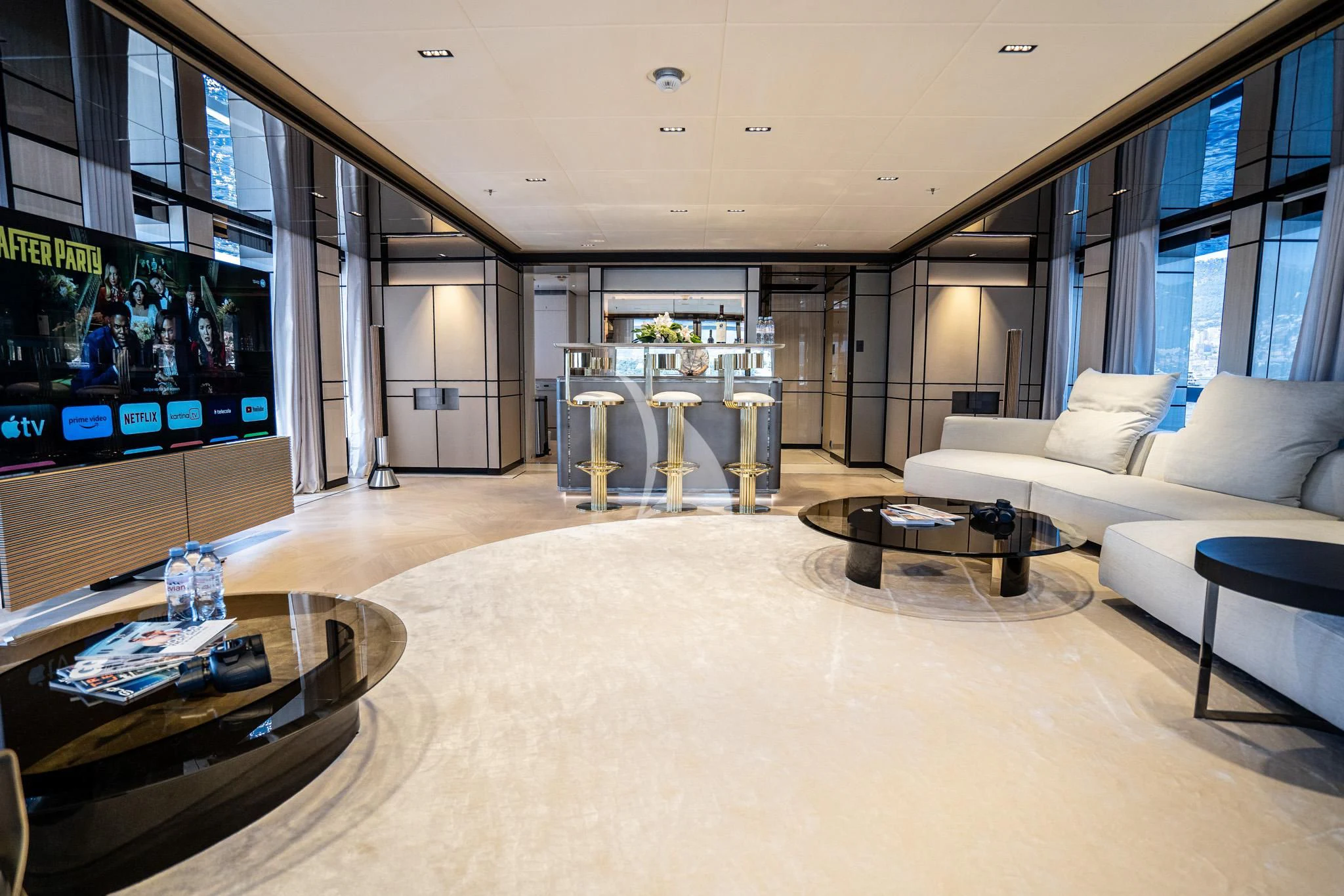 a living room with a large screen aboard RELIANCE Yacht for Sale