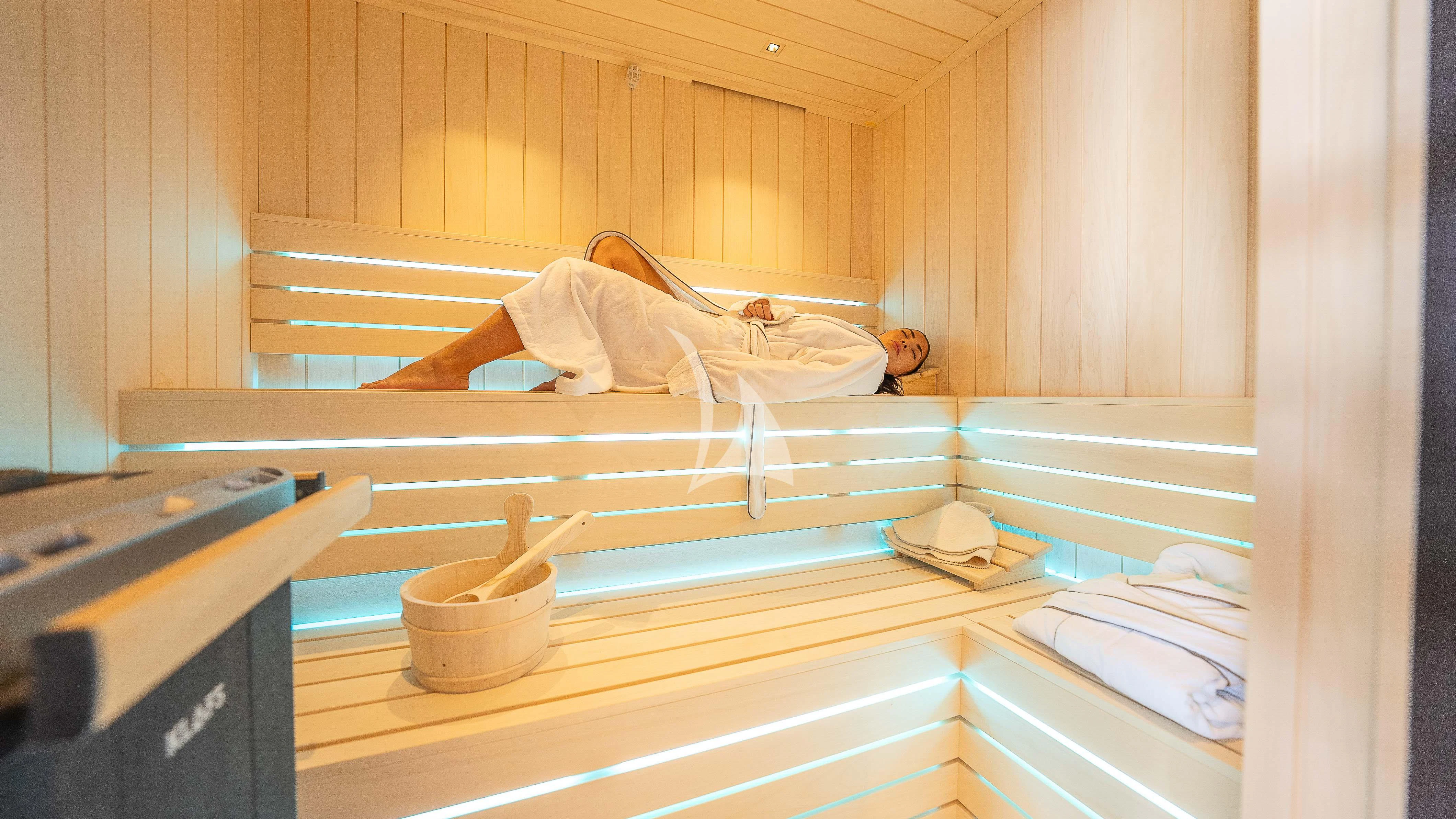 a person lying on a shelf aboard RELIANCE Yacht for Sale