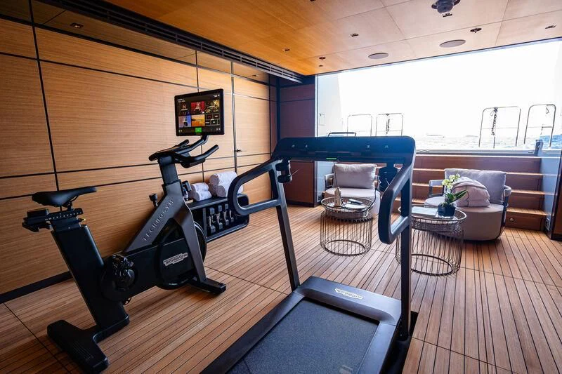 a gym with a bench and a bench aboard RELIANCE Yacht for Sale