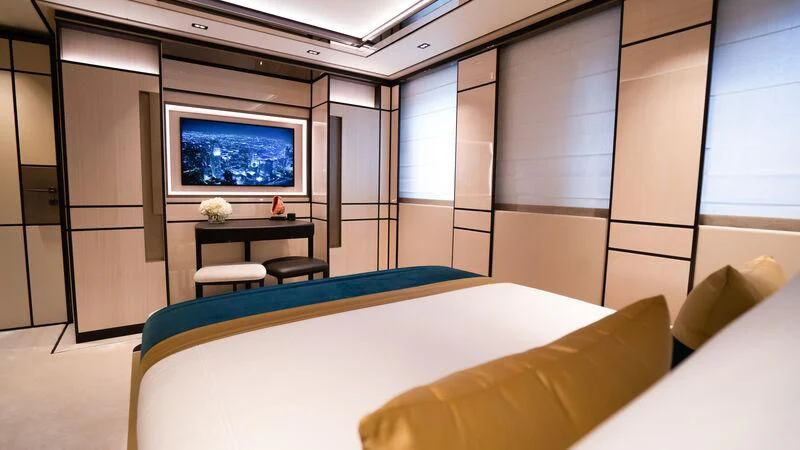 a room with a table and chairs aboard RELIANCE Yacht for Sale