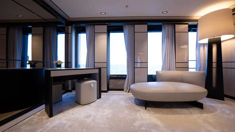 a room with a couch and a table aboard RELIANCE Yacht for Sale