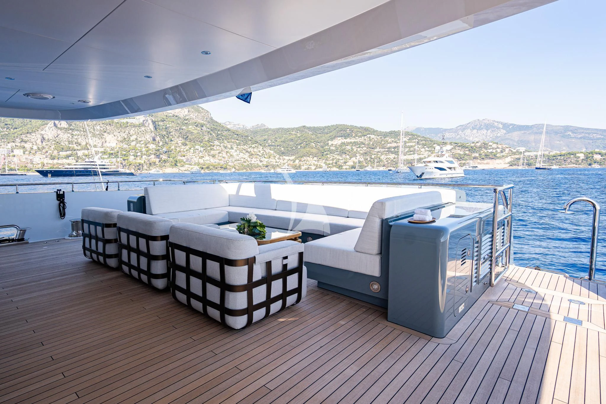 a deck with a view of a city and water aboard RELIANCE Yacht for Sale