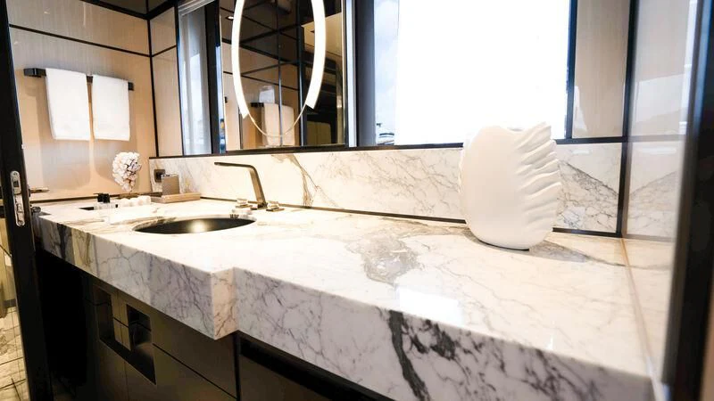 a bathroom with a countertop sink and a towel on the counter aboard RELIANCE Yacht for Sale