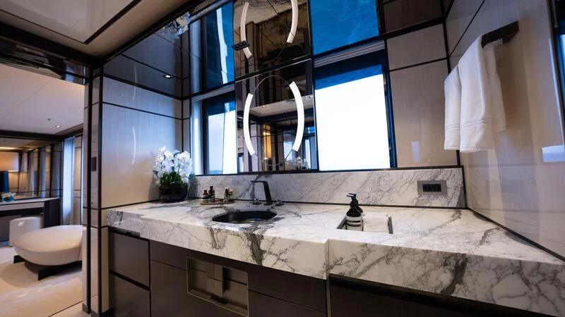 a bathroom with a sink and a mirror aboard RELIANCE Yacht for Sale