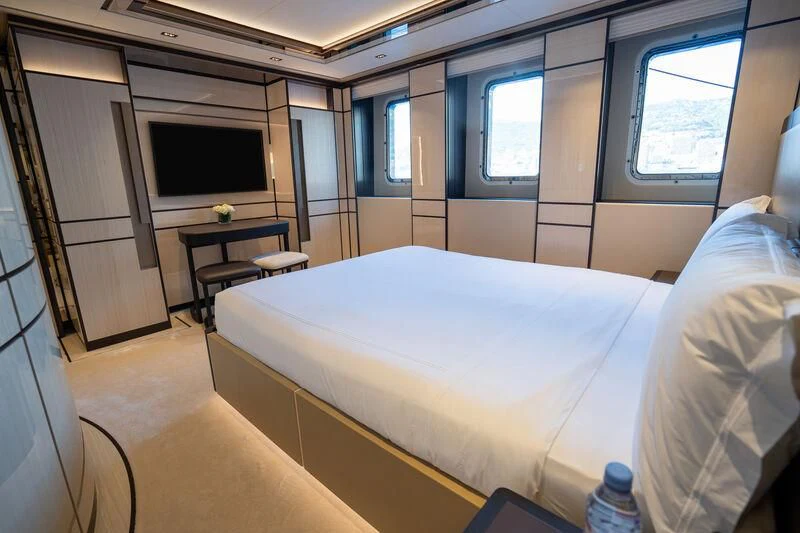 a room with a bed and a table aboard RELIANCE Yacht for Sale