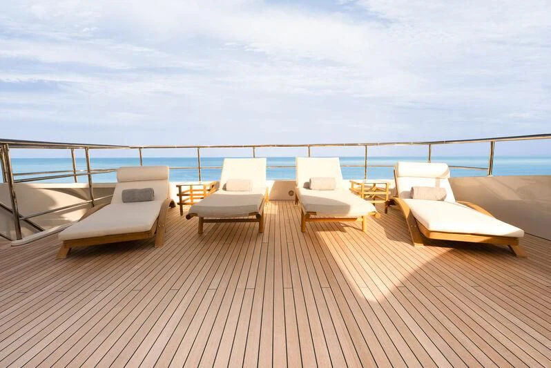 a deck with chairs on it aboard RELIANCE Yacht for Sale