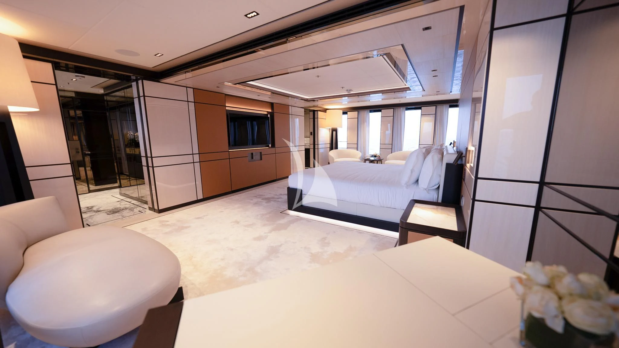 a room with a bed and a chair aboard RELIANCE Yacht for Sale