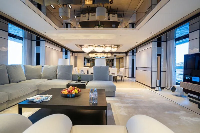 a living room with a couch and a table aboard RELIANCE Yacht for Sale