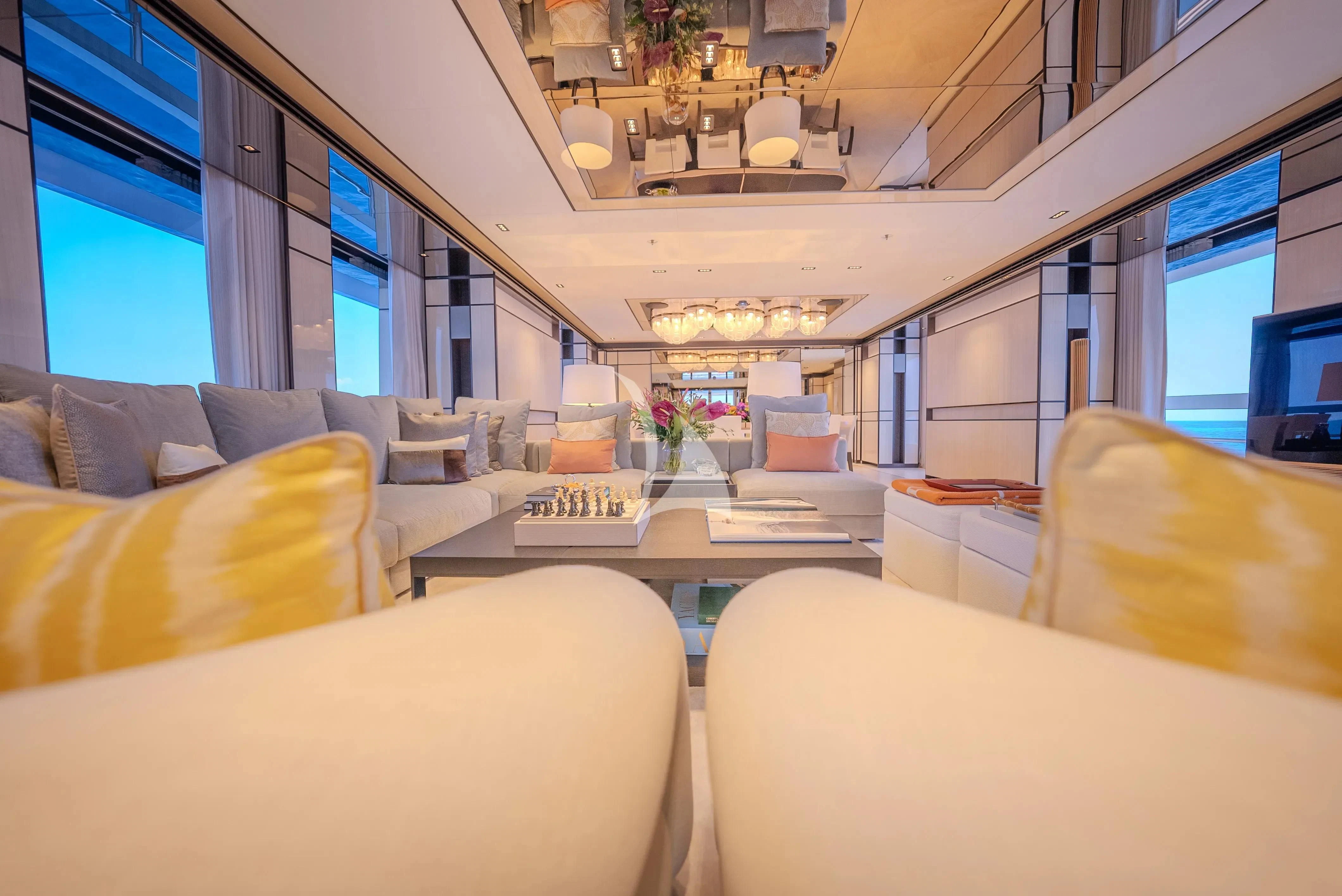 inside of a vehicle with a table and chairs and a desk with a computer on it aboard RELIANCE Yacht for Sale