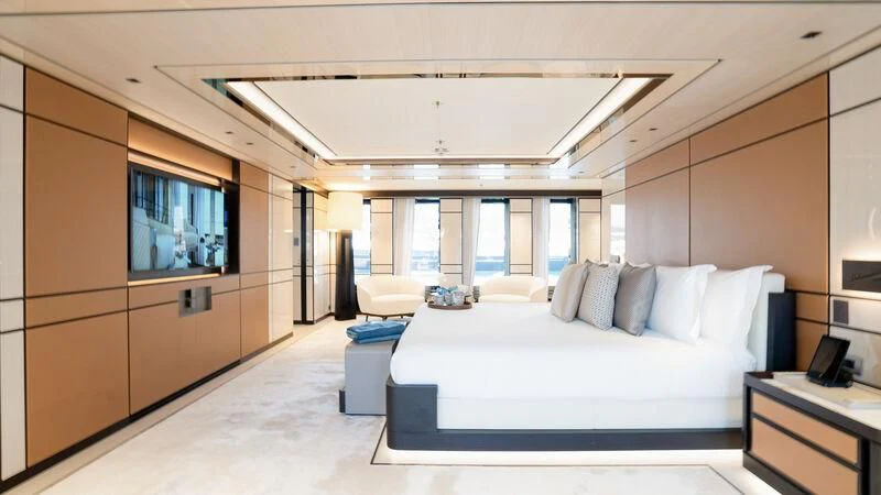 a room with a bed and a large window aboard RELIANCE Yacht for Sale