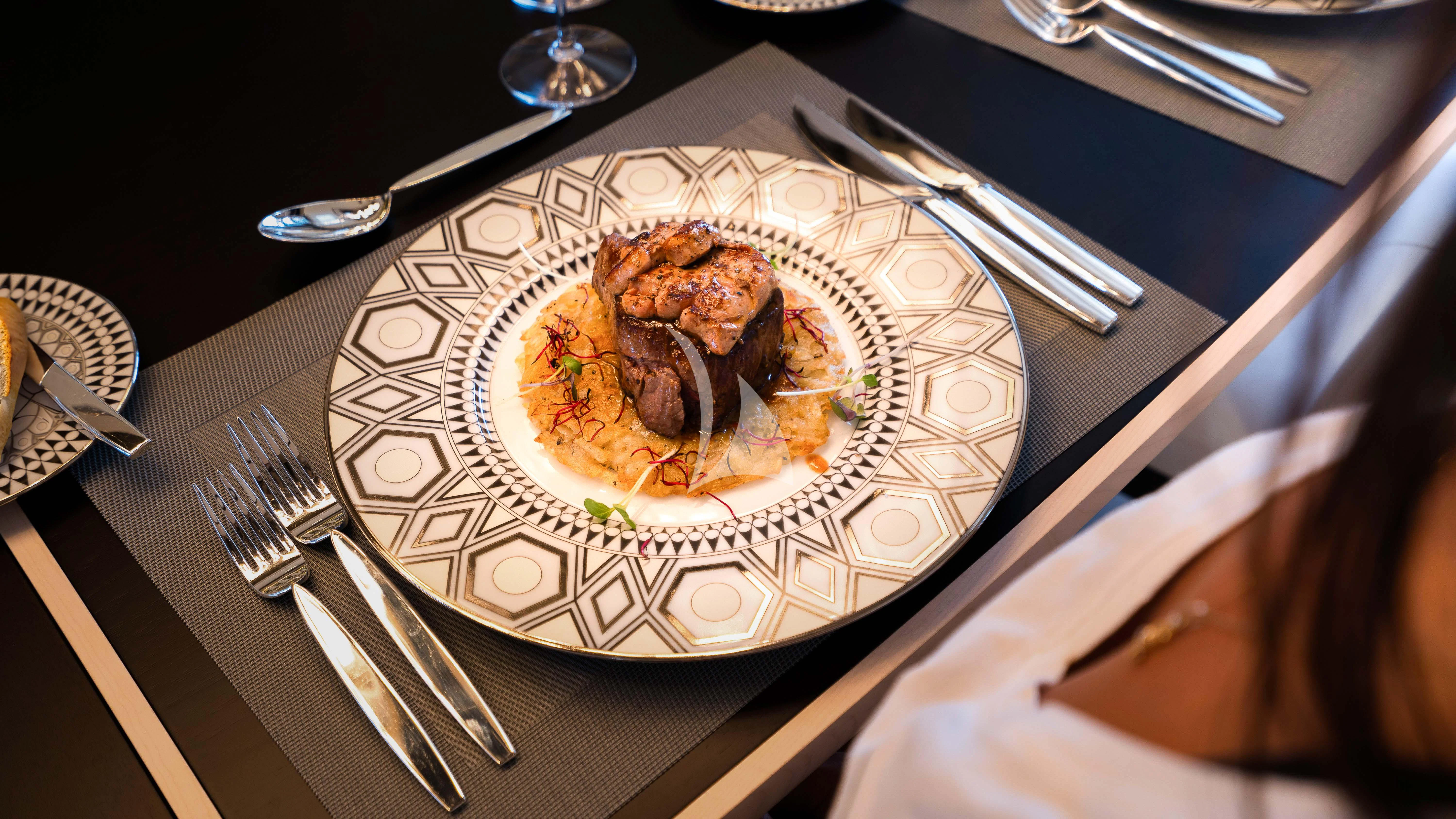 a plate of food aboard RELIANCE Yacht for Sale