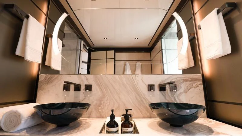 a kitchen with a sink and a mirror aboard RELIANCE Yacht for Sale