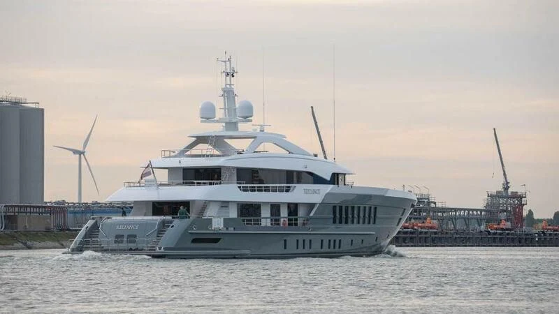 a large white boat in the water aboard RELIANCE Yacht for Sale