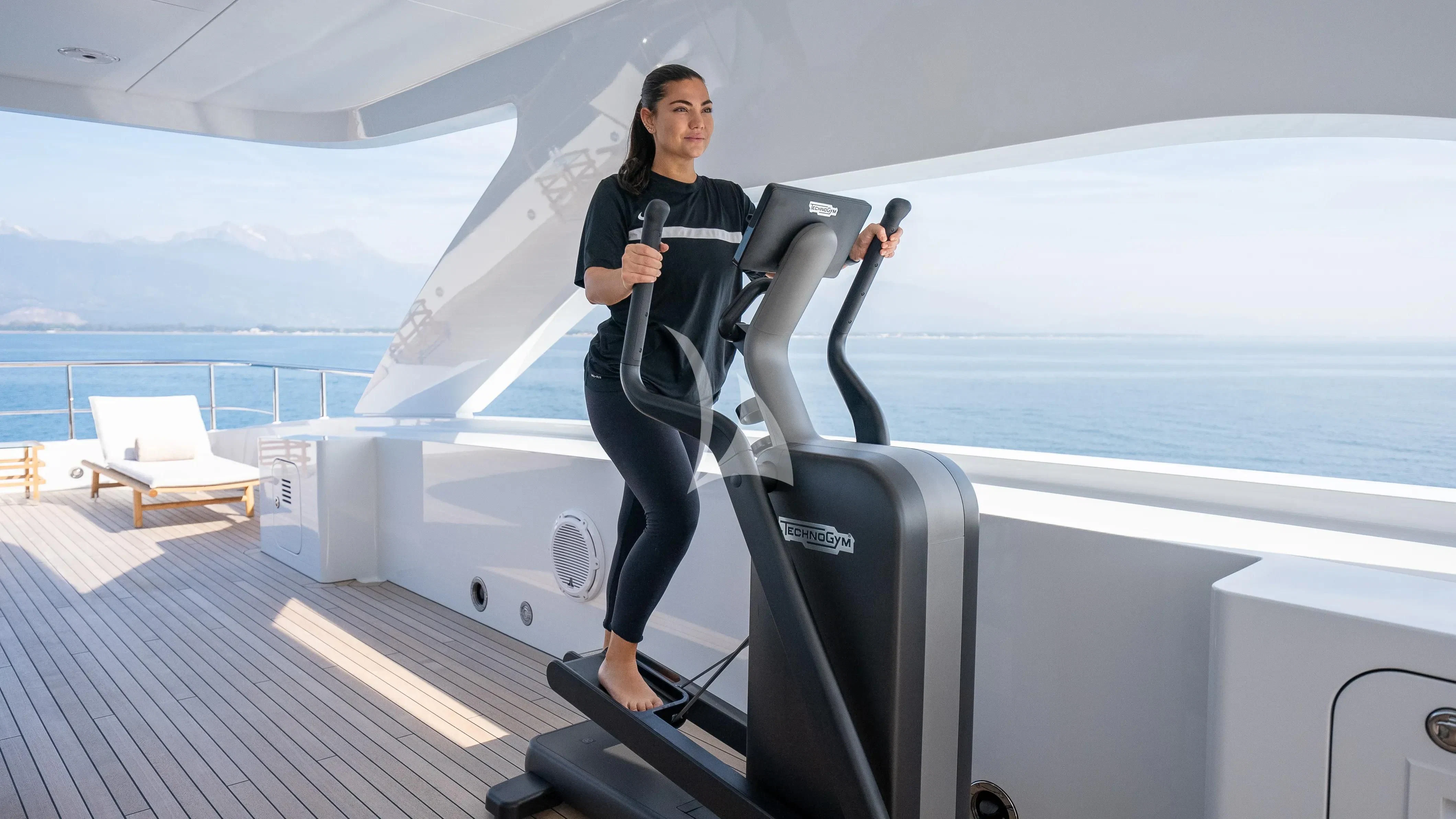 a person standing on a deck aboard RELIANCE Yacht for Sale