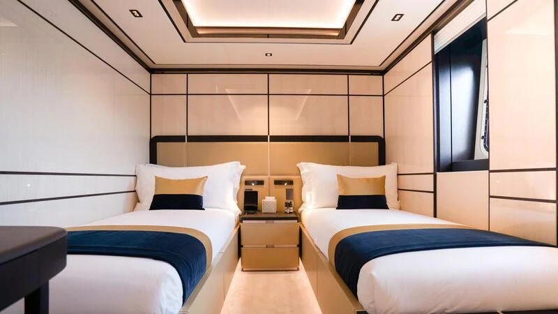 a room with two beds aboard RELIANCE Yacht for Sale