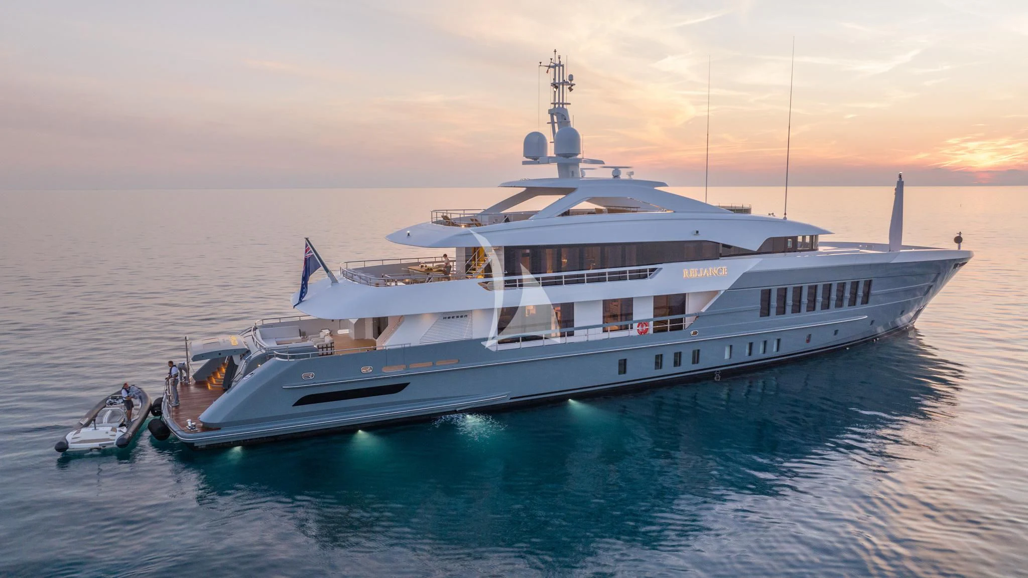 a large white boat in the water aboard RELIANCE Yacht for Sale
