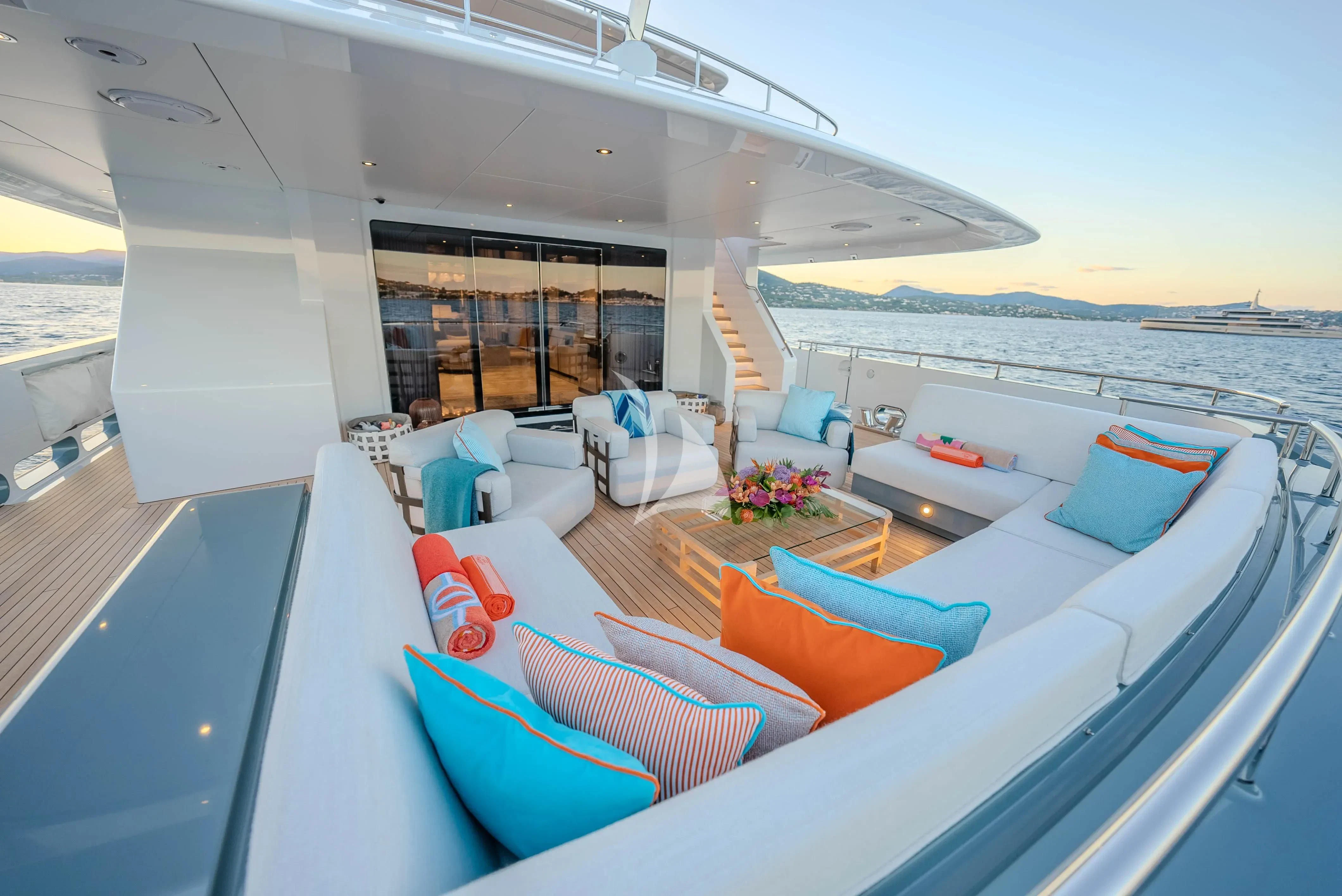a large lounge area with a large patio and a large body of water aboard RELIANCE Yacht for Sale