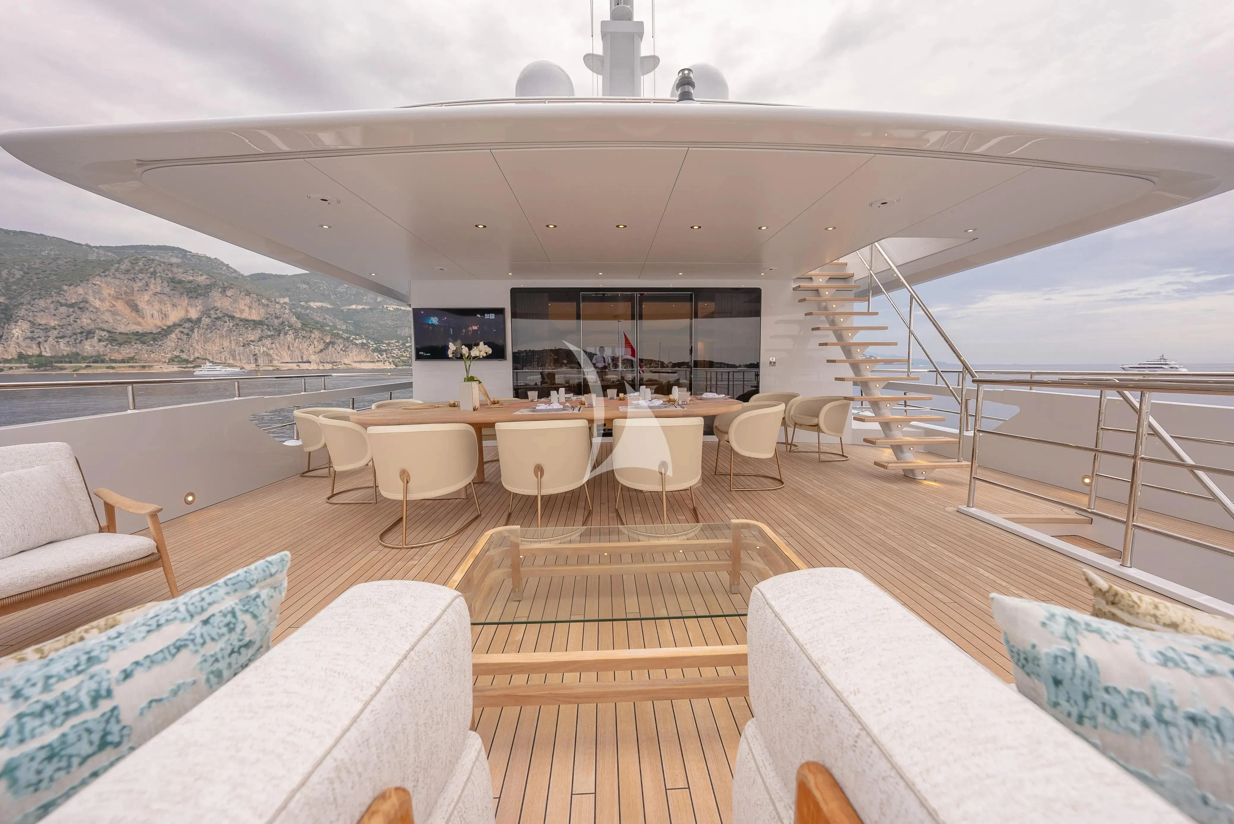 a large living room with a large balcony aboard RELIANCE Yacht for Sale