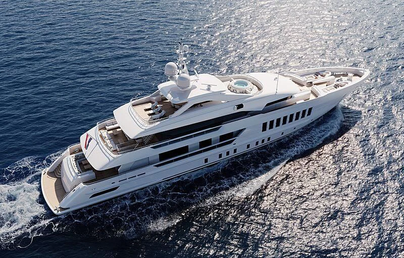 a white boat on a beach aboard RELIANCE Yacht for Sale