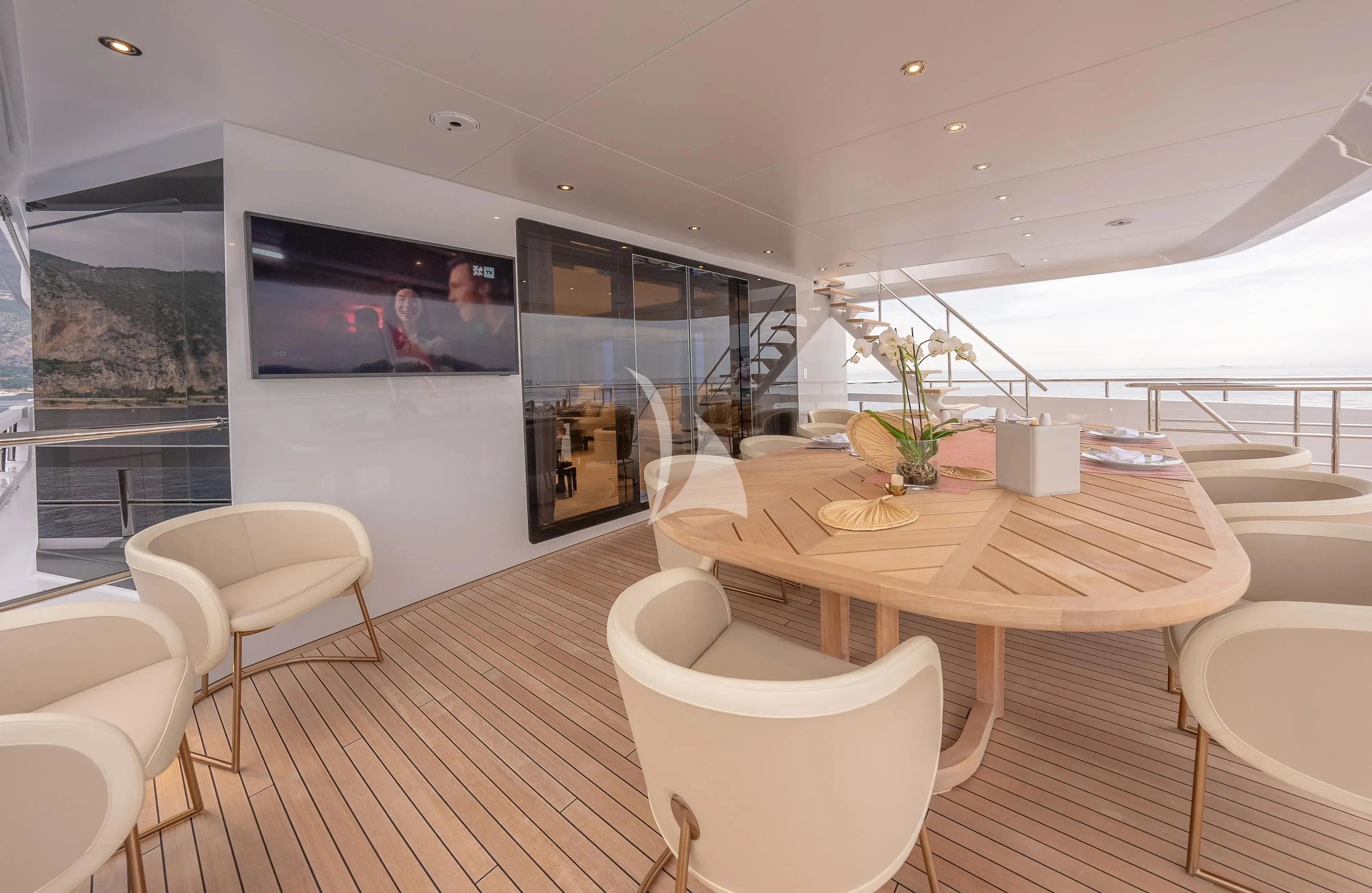 a room with a table and chairs aboard RELIANCE Yacht for Sale