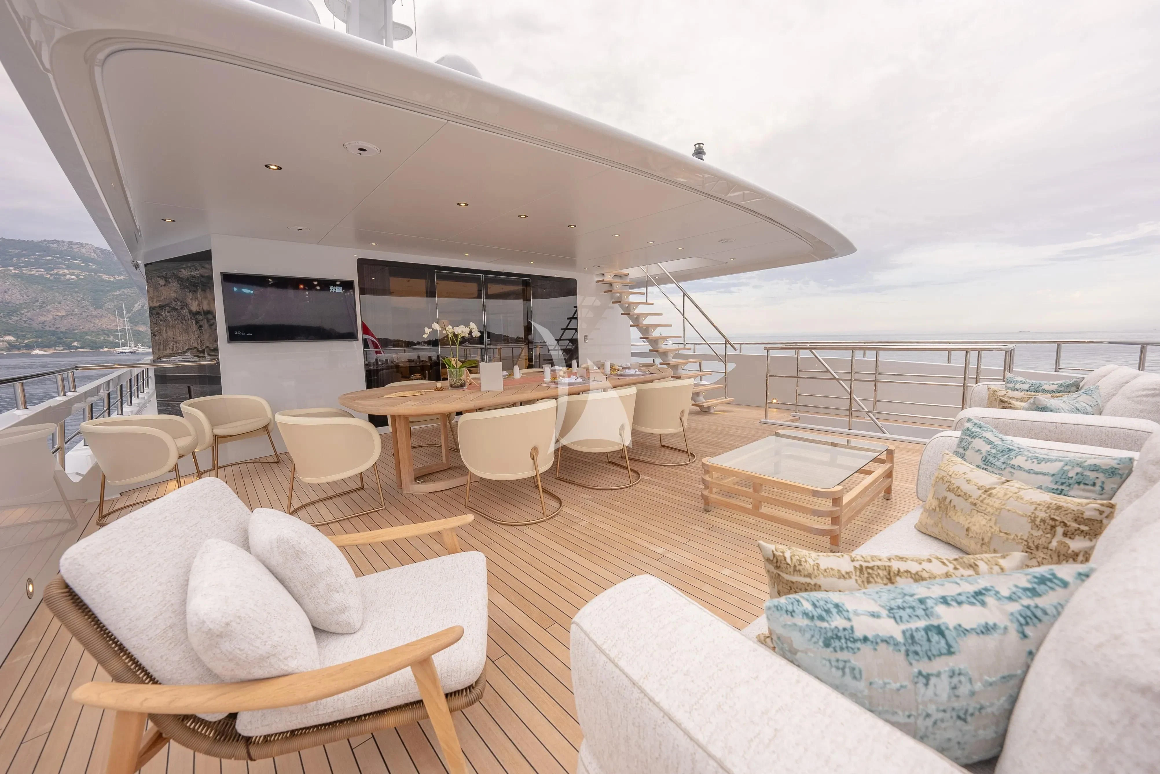 a living room with a large balcony aboard RELIANCE Yacht for Sale