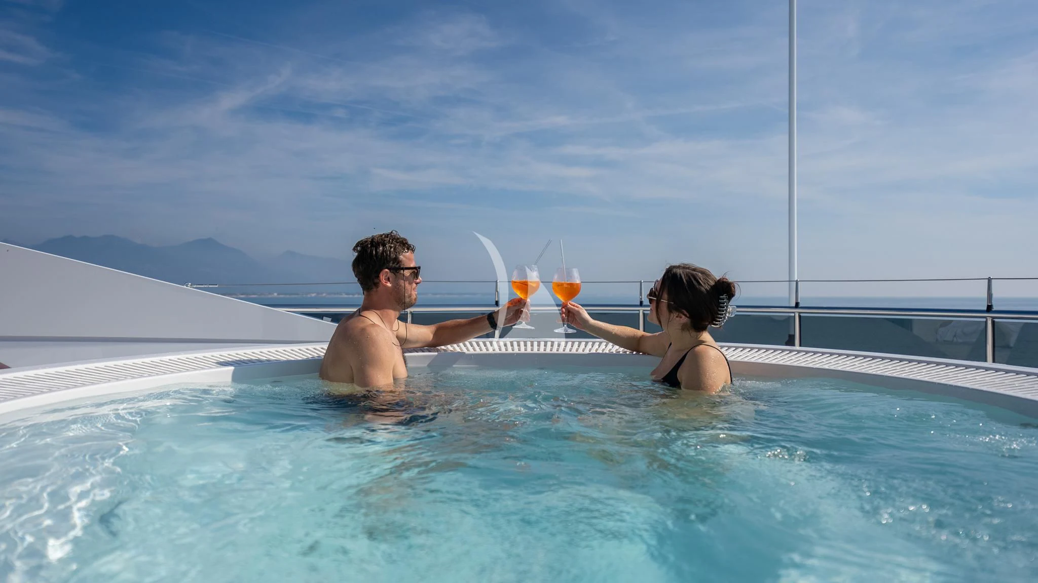 a man and woman in a pool aboard RELIANCE Yacht for Sale