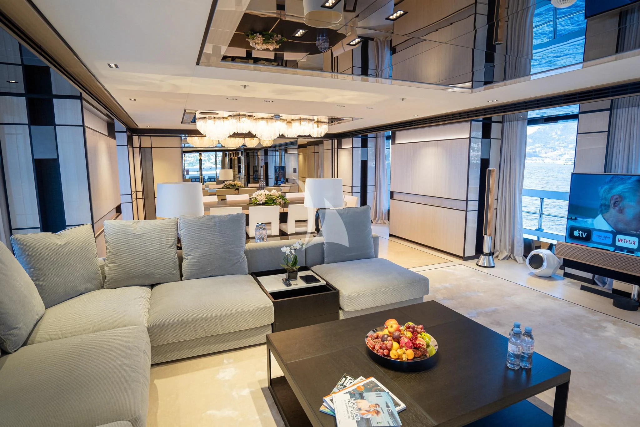 a living room with a large window aboard RELIANCE Yacht for Sale