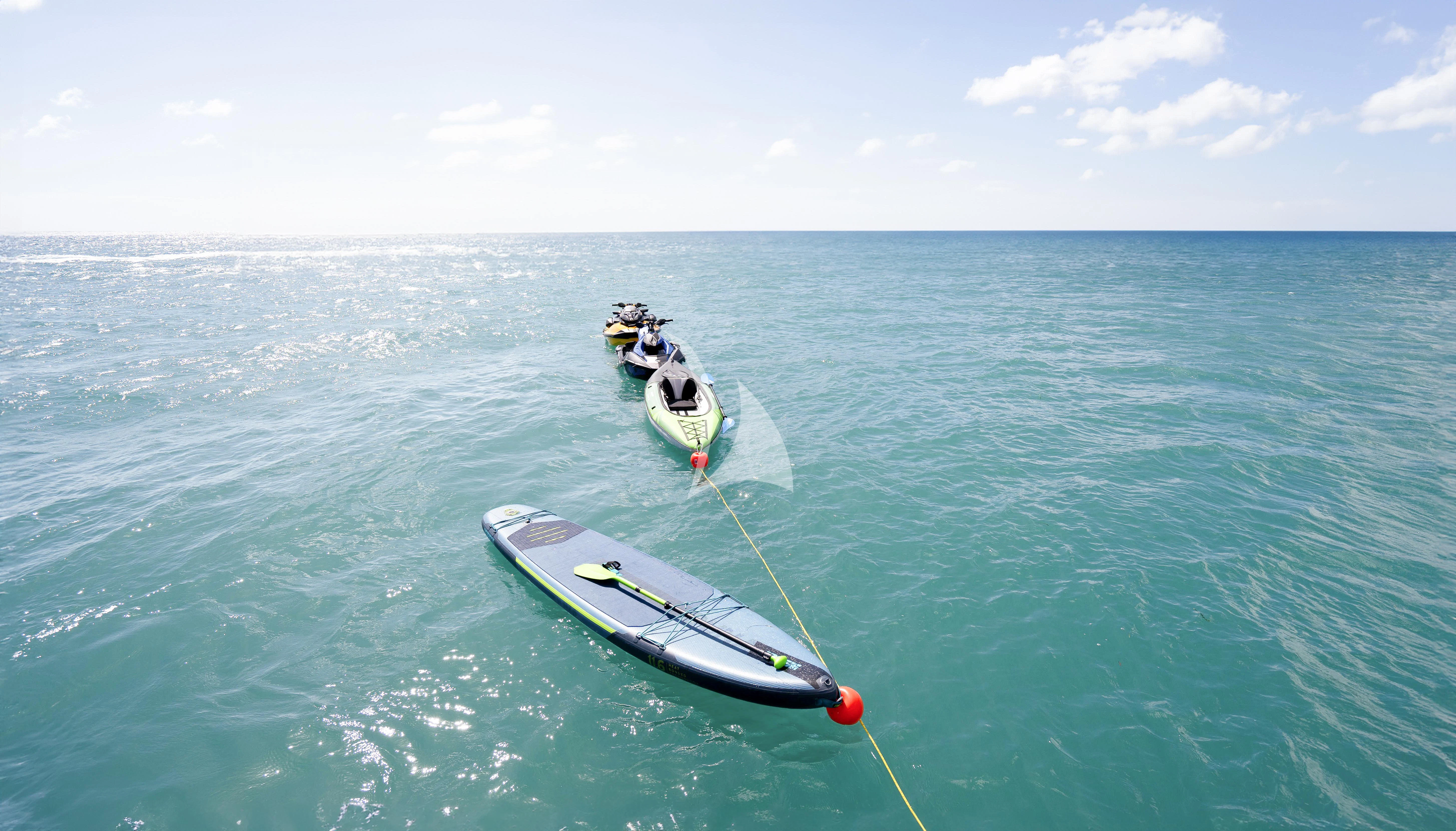 a couple of boats in the water aboard RELIANCE Yacht for Sale