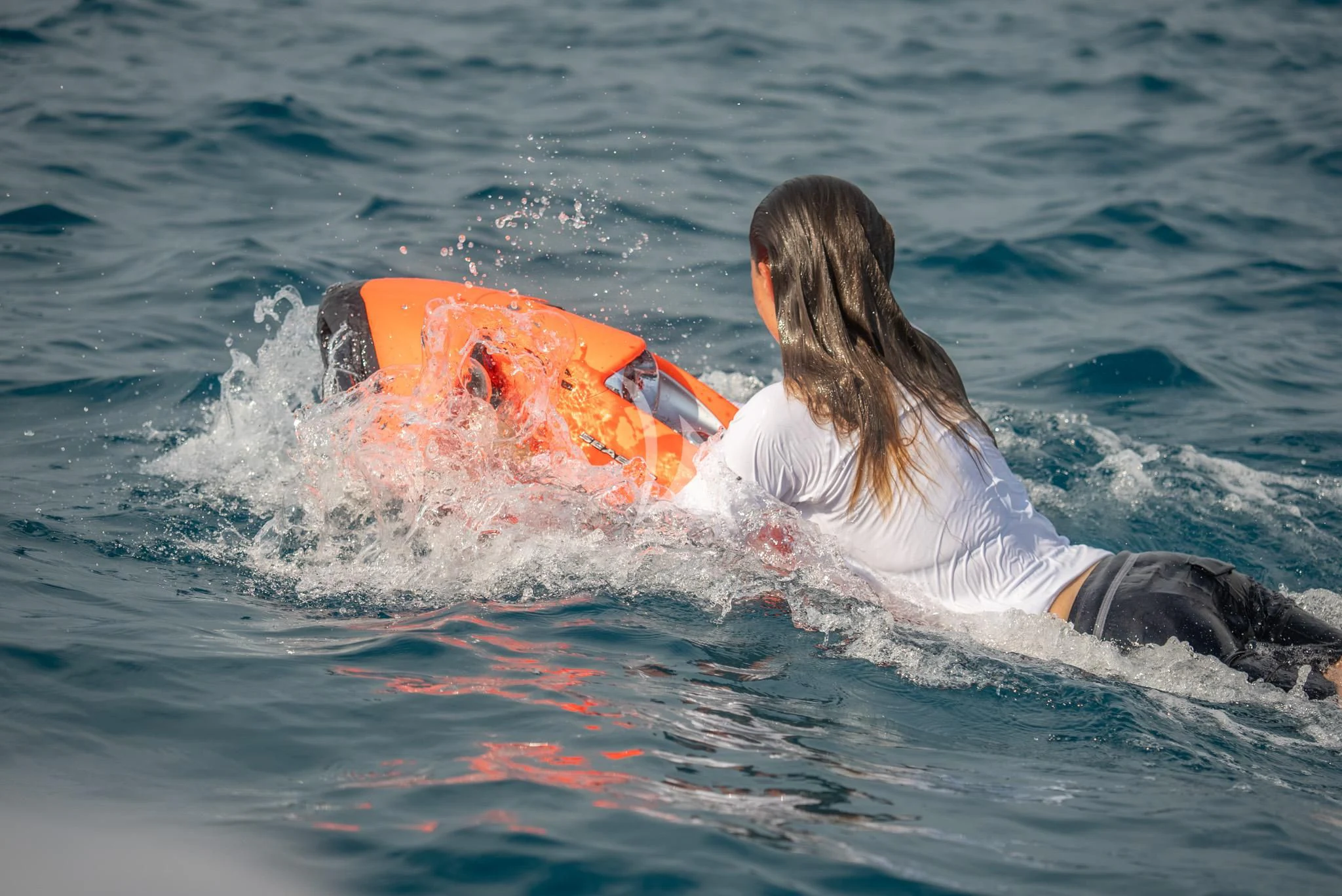 a person in the water with a boogie board aboard RELIANCE Yacht for Sale