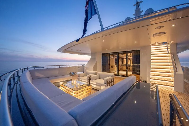 a large pool with a deck and a view of the ocean aboard RELIANCE Yacht for Sale