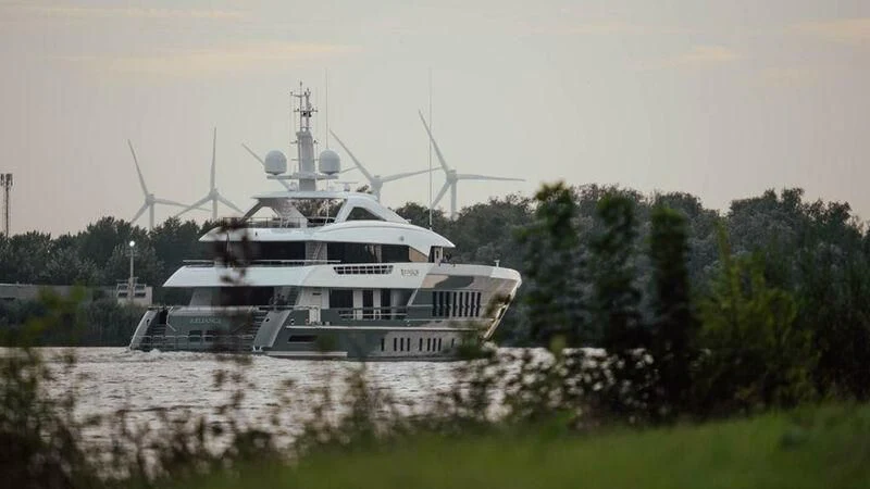 a large white boat in a grassy field aboard RELIANCE Yacht for Sale