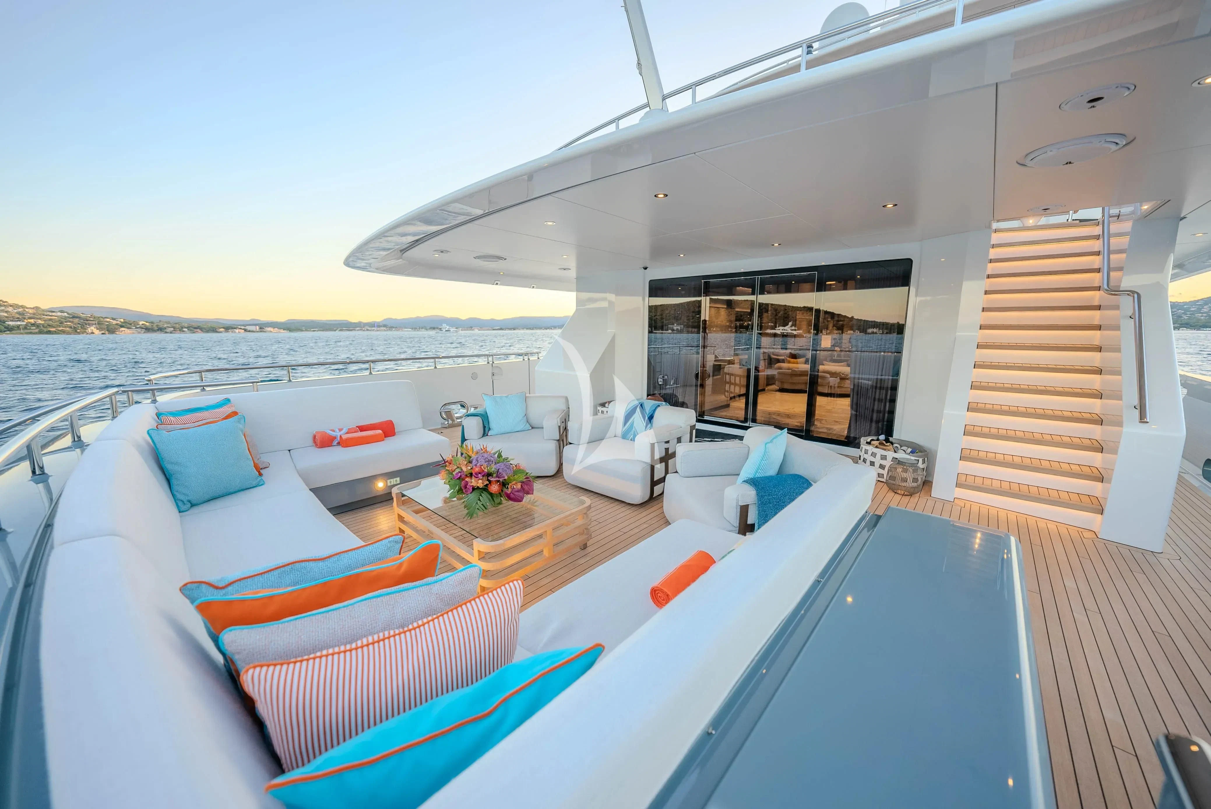 a large living room with a large balcony aboard RELIANCE Yacht for Sale
