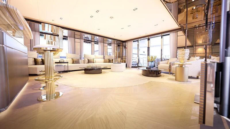 a large room with a large wood floor and a large window aboard RELIANCE Yacht for Sale