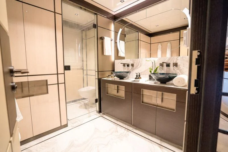 a bathroom with a large mirror aboard RELIANCE Yacht for Sale