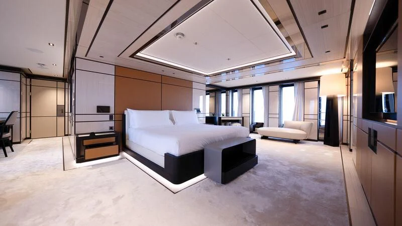 a large room with a bed and a couch aboard RELIANCE Yacht for Sale